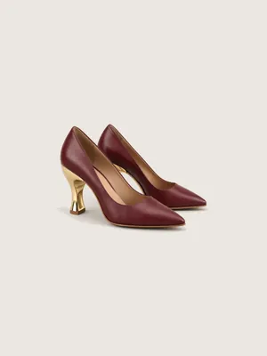 AI-generated product photo of the burgundy sculpture, one of the pieces in the Someone Shop.